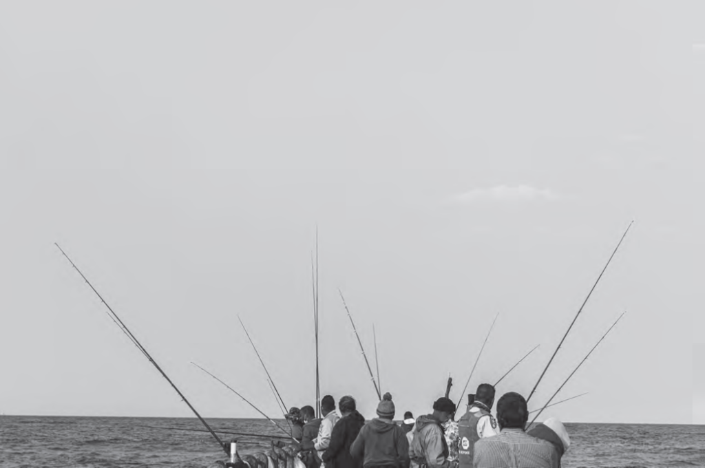 Black and white photograph of fishers in South Africa