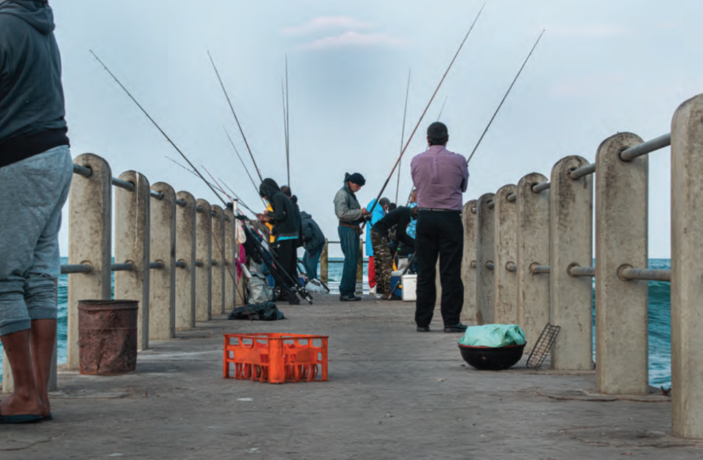 Fishers on a pier